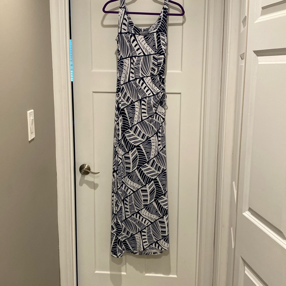 Dress is ankle length, white and navy blue.  A slit up the side.